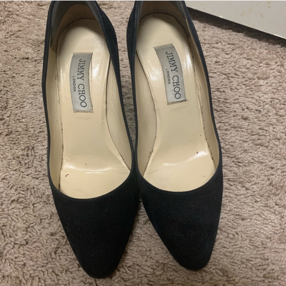 Black suede almond toe pumps
